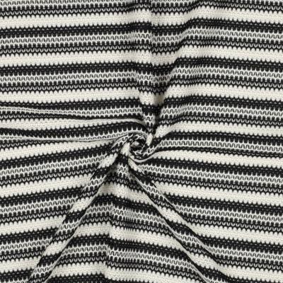 Tissu façon crochet noir et crème